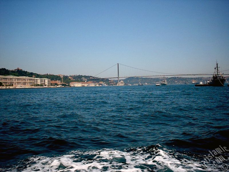 View of the Ciragan Palace and the Bosphorus Bridge from the Bosphorus in Istanbul city of Turkey.

