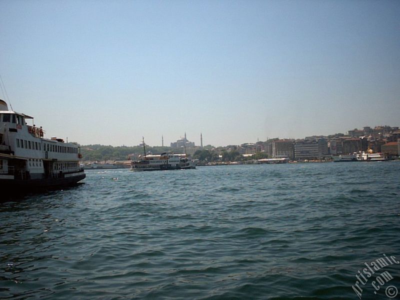 View of Eminonu coast and Ayasofya Mosque (Hagia Sophia) from the shore of Karakoy in Istanbul city of Turkey.
