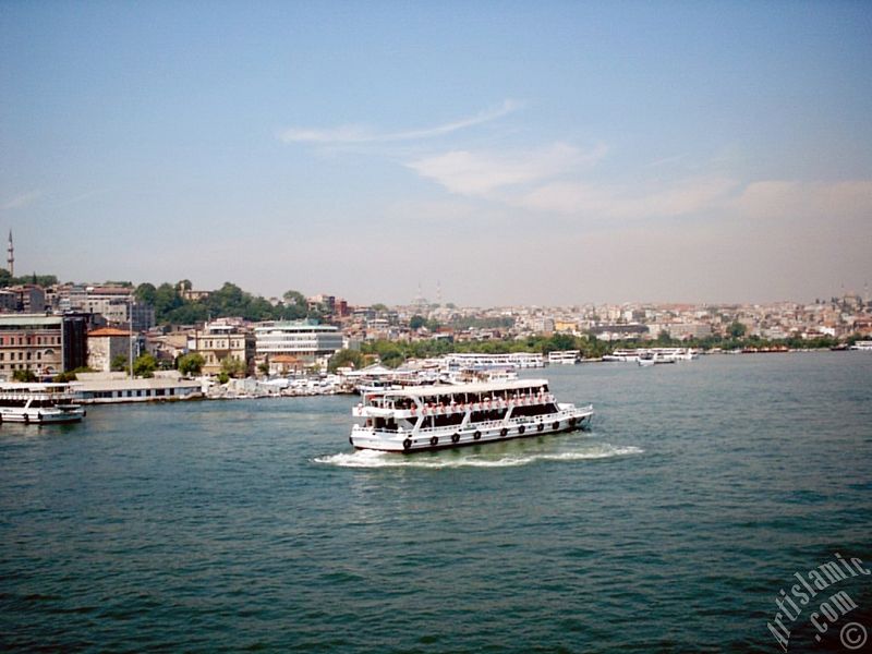 View of Eminonu-Sarachane coast, on the horizon in the middle Fatih Mosque and on the right Yavuz Sultan Selim Mosque from Galata Bridge located in Istanbul city of Turkey.
