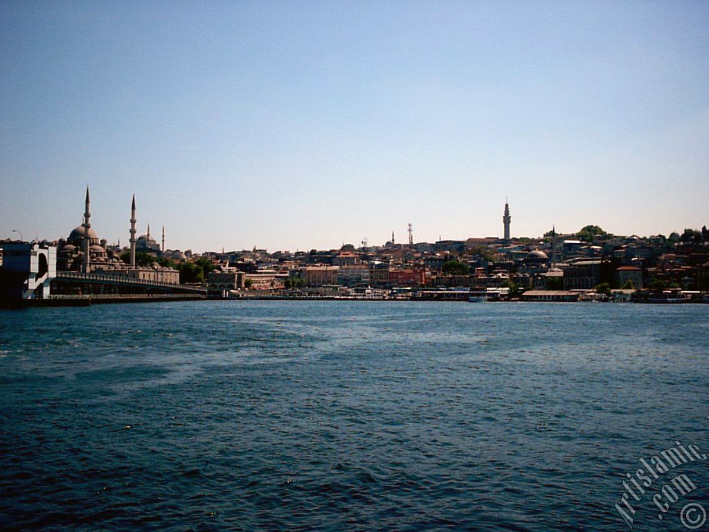 View of Eminonu coast, (from left) Galata Bridge, Yeni Cami (Mosque), Sultan Ahmet Mosque (Blue Mosque), (below) Egyptian Bazaar (Spice Market) and Beyazit Tower from the shore of Karakoy-Persembe Pazari in Istanbul city of Turkey.
