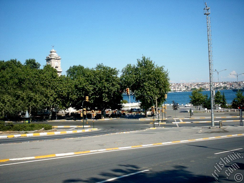 View of Dolmabahce coast and clock tower in Dolmabahce district in Istanbul city of Turkey.
