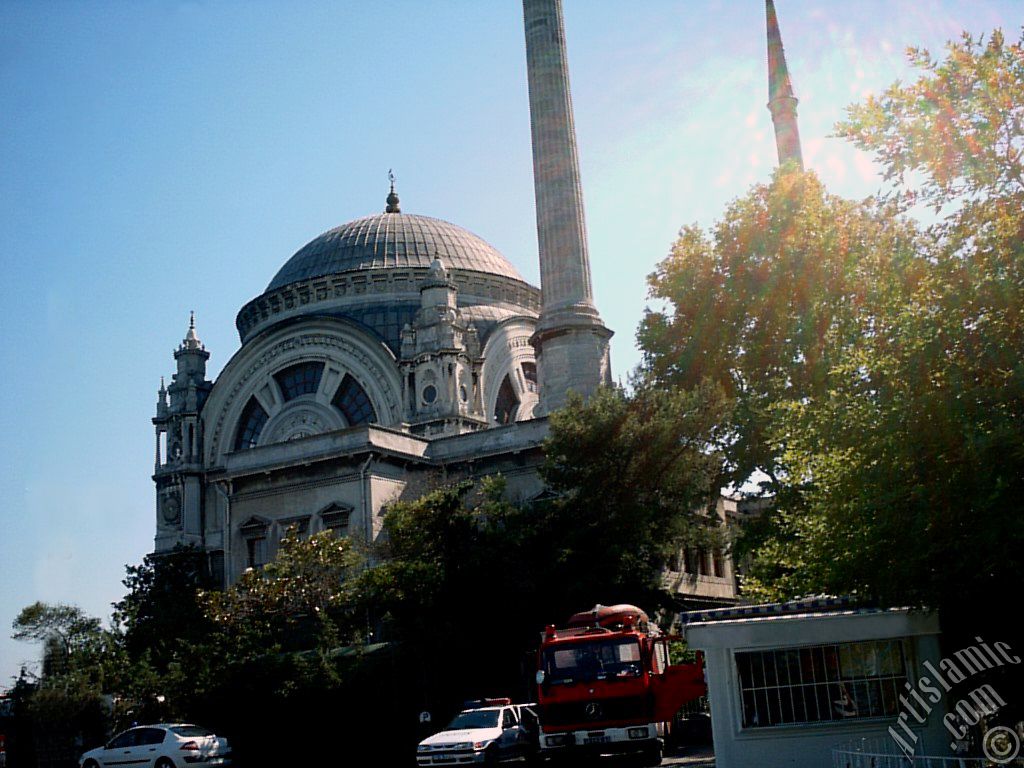 View of Valide Sultan Mosque from the entrance of the Dolmabahce Palace in Dolmabahce district in Istanbul city of Turkey.
