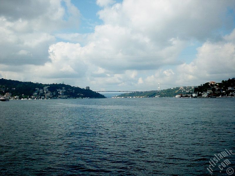 View towards Fatih Sultan Mehmet Bridge over the Bosphorus from between Arnavutkoy shore and Vanikoy shore in the middle of the Bosphorus in Istanbul city of Turkey.
