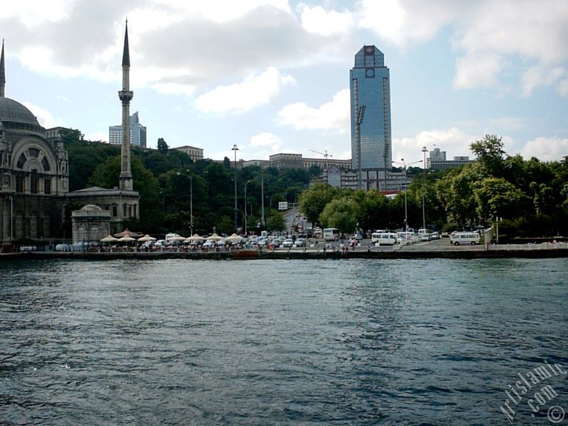 View of Dolmabahce coast and Valide Sultan Mosque from the Bosphorus in Istanbul city of Turkey.
