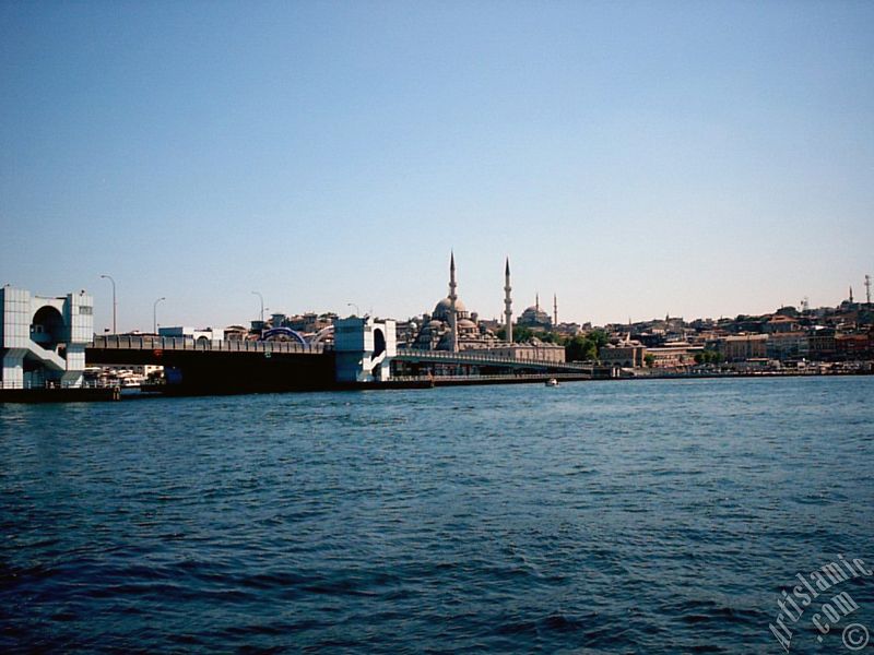 View of Eminonu coast, (from left) Galata Bridge, Yeni Cami (Mosque), Sultan Ahmet Mosque (Blue Mosque) and (below) Egyptian Bazaar (Spice Market) from the shore of Karakoy-Persembe Pazari in Istanbul city of Turkey.
