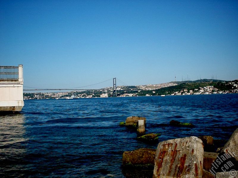 View of the Bosphorus Bridge, Camlica Hill and Uskudar-Beylerbeyi coast from a park at Besiktas shore in Istanbul city of Turkey.
