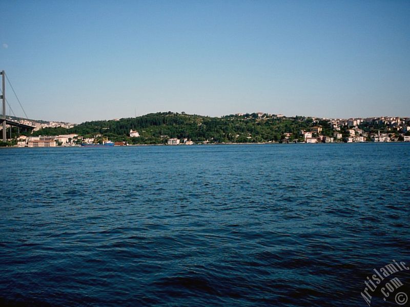 View of Bosphorus Bridge and Beylerbeyi coast from a park at Ortakoy shore in Istanbul city of Turkey.
