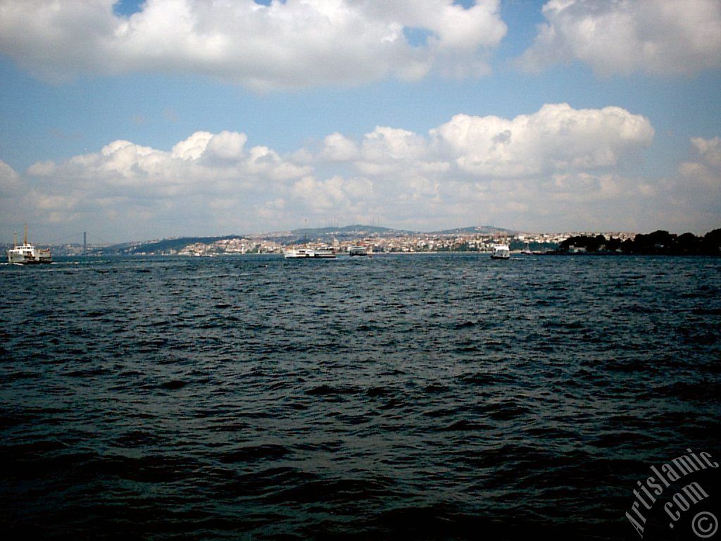 View of Sarayburnu coast and Camlica hill from the shore of Eminonu in Istanbul city of Turkey.
