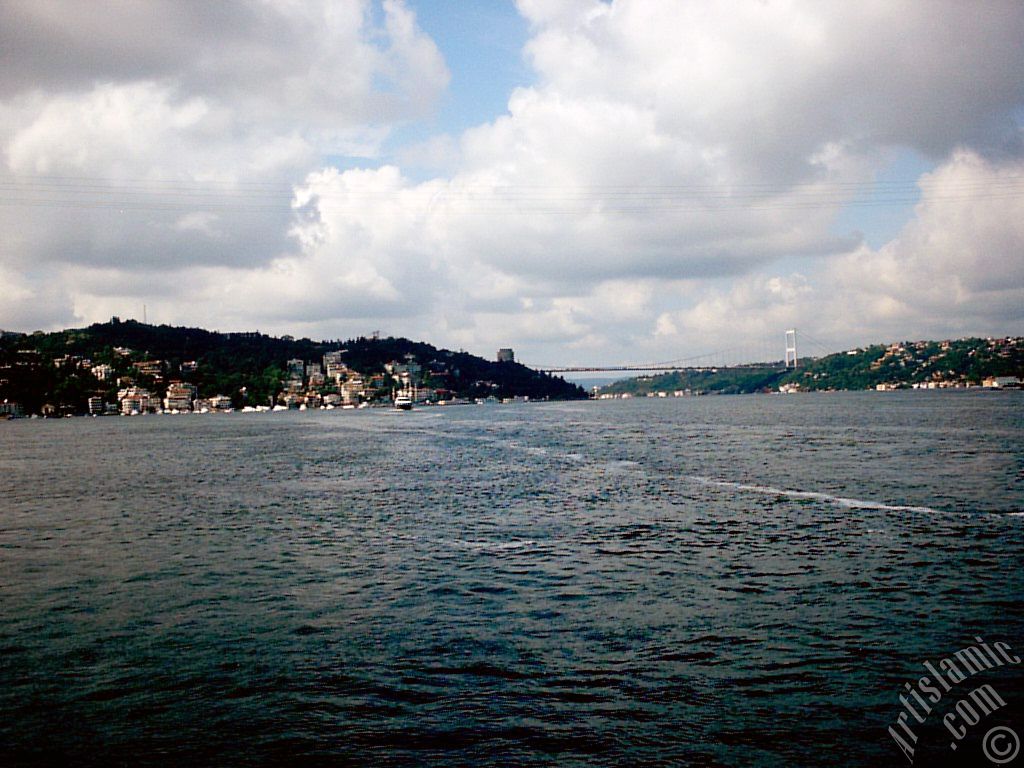 View towards Fatih Sultan Mehmet Bridge over the Bosphorus from between Arnavutkoy shore and Vanikoy shore in the middle of the Bosphorus in Istanbul city of Turkey.
