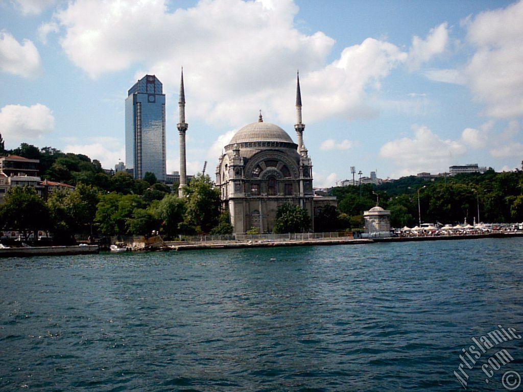 View of Dolmabahce coast and Valide Sultan Mosque from the Bosphorus in Istanbul city of Turkey.
