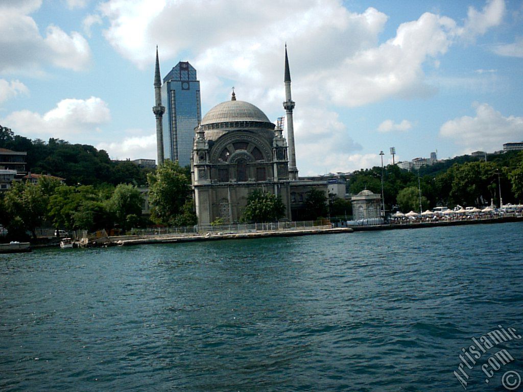 View of Dolmabahce coast and Valide Sultan Mosque from the Bosphorus in Istanbul city of Turkey.
