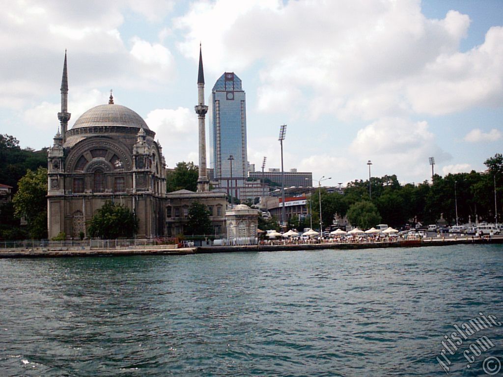 View of Dolmabahce coast and Valide Sultan Mosque from the Bosphorus in Istanbul city of Turkey.
