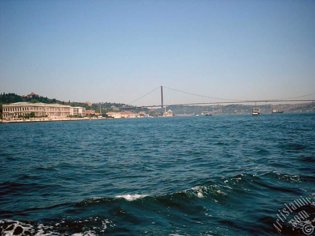 View of the Ciragan Palace and the Bosphorus Bridge from the Bosphorus in Istanbul city of Turkey.
