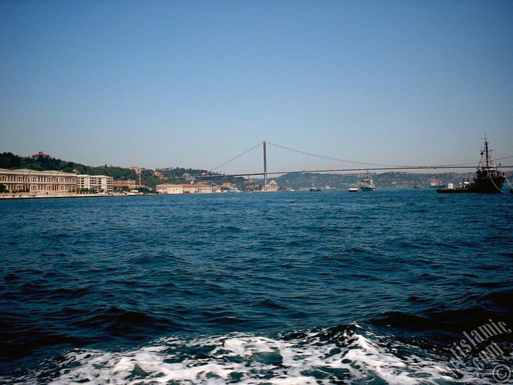 View of the Ciragan Palace and the Bosphorus Bridge from the Bosphorus in Istanbul city of Turkey.
