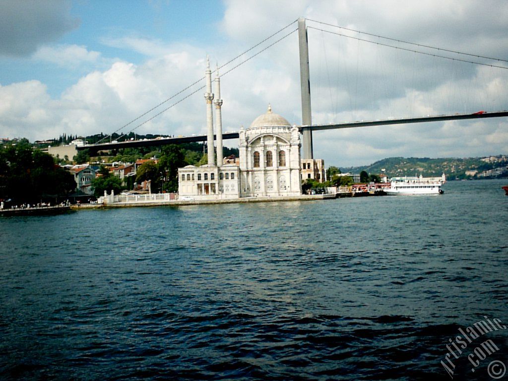 View of Ortakoy coast, Ortakoy Mosque and Bosphorus Bridge from the Bosphorus in Istanbul city of Turkey.
