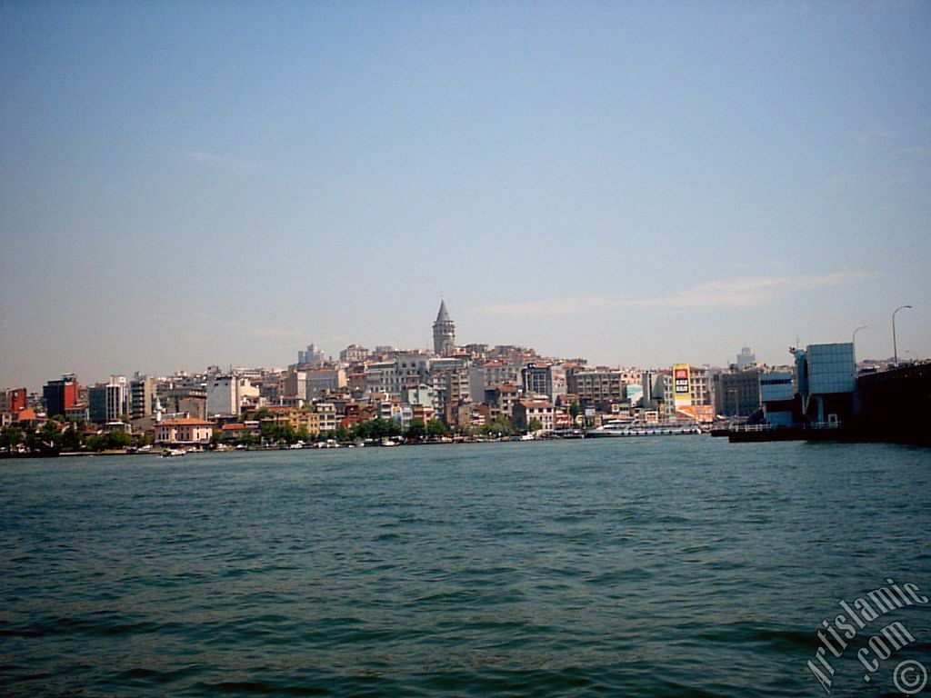 View of Karakoy coast and Galata Bridge from the shore of Eminonu in Istanbul city of Turkey.
