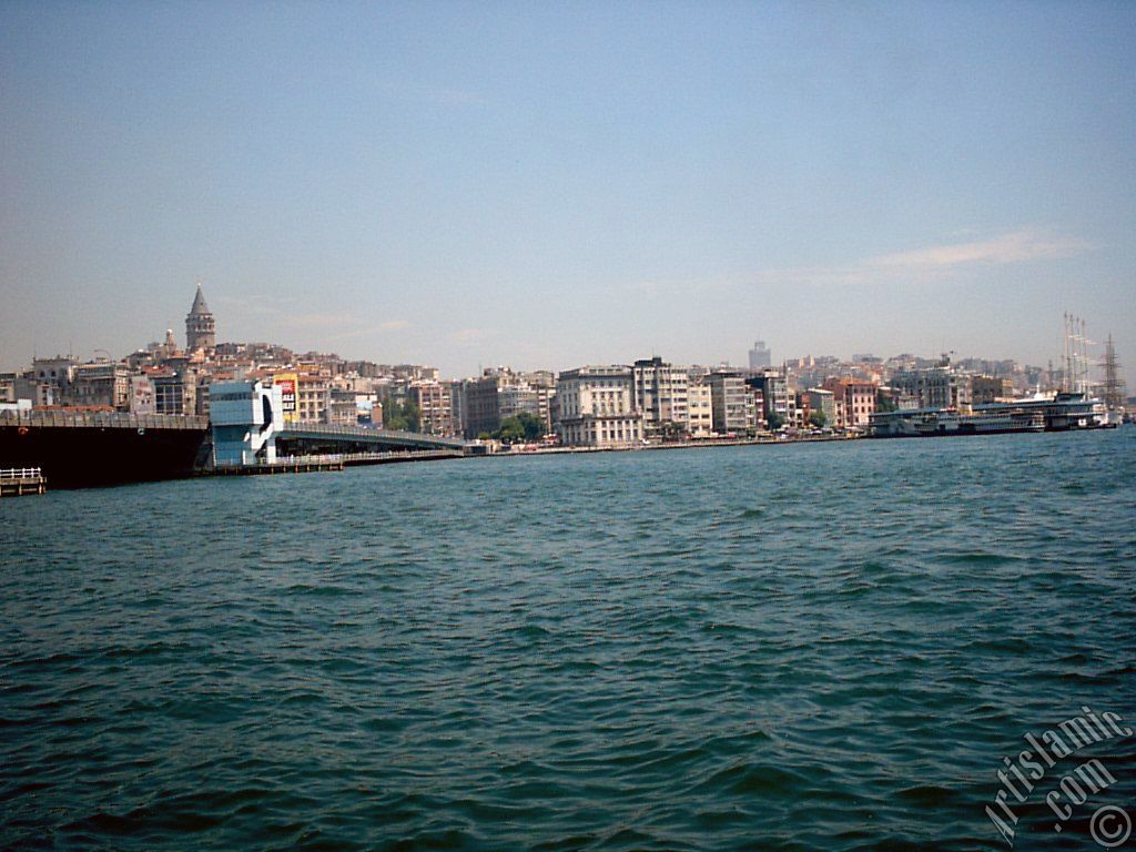 View of Karakoy coast, Galata Bridge and Galata Tower from the shore of Eminonu in Istanbul city of Turkey.
