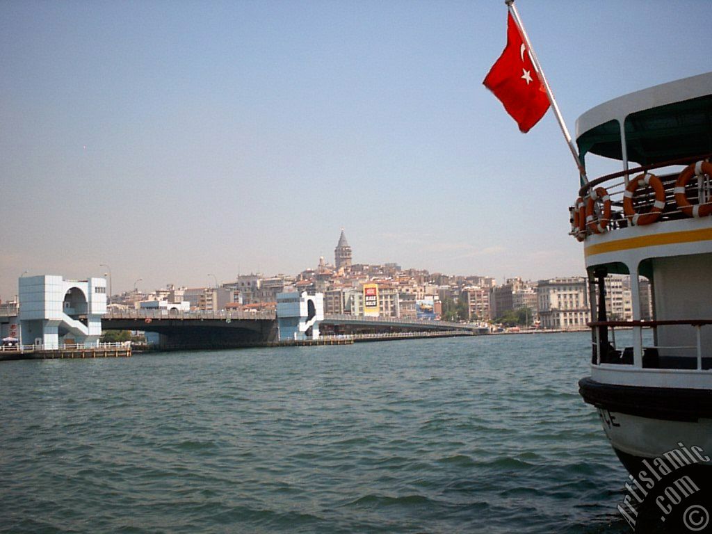 View of Karakoy coast, Galata Bridge and Galata Tower from the shore of Eminonu in Istanbul city of Turkey.
