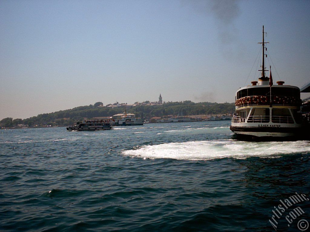 View of Eminonu coast, the ship and Topkapi Palace from the shore of Karakoy in Istanbul city of Turkey.
