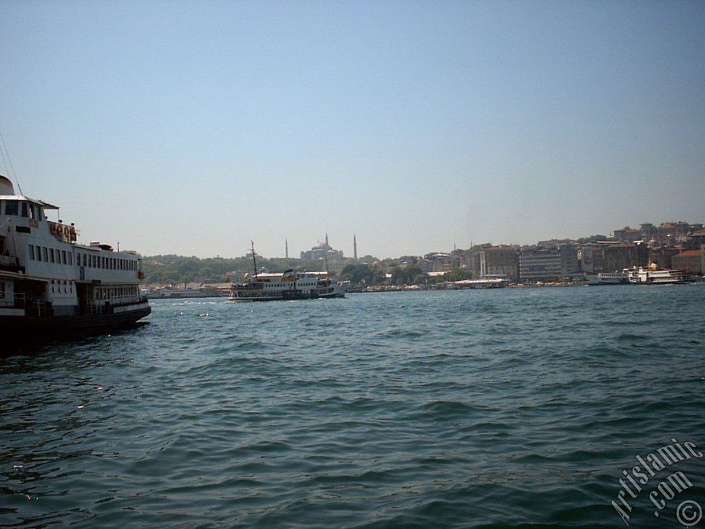 View of Eminonu coast and Ayasofya Mosque (Hagia Sophia) from the shore of Karakoy in Istanbul city of Turkey.
