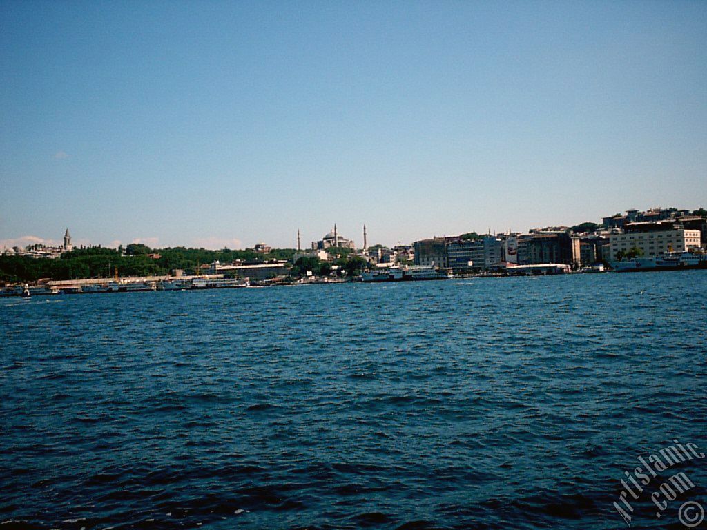 View of Eminonu coast, Ayasofya Mosque (Hagia Sophia) and Topkapi Palace from the shore of Karakoy in Istanbul city of Turkey.
