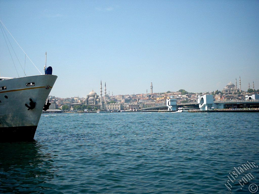 View of Eminonu coast, Yeni Cami (Mosque), (at far behind) Beyazit Mosque, Beyazit Tower, Galata Brigde and Suleymaniye Mosque from Karakoy jetty in Istanbul city of Turkey.
