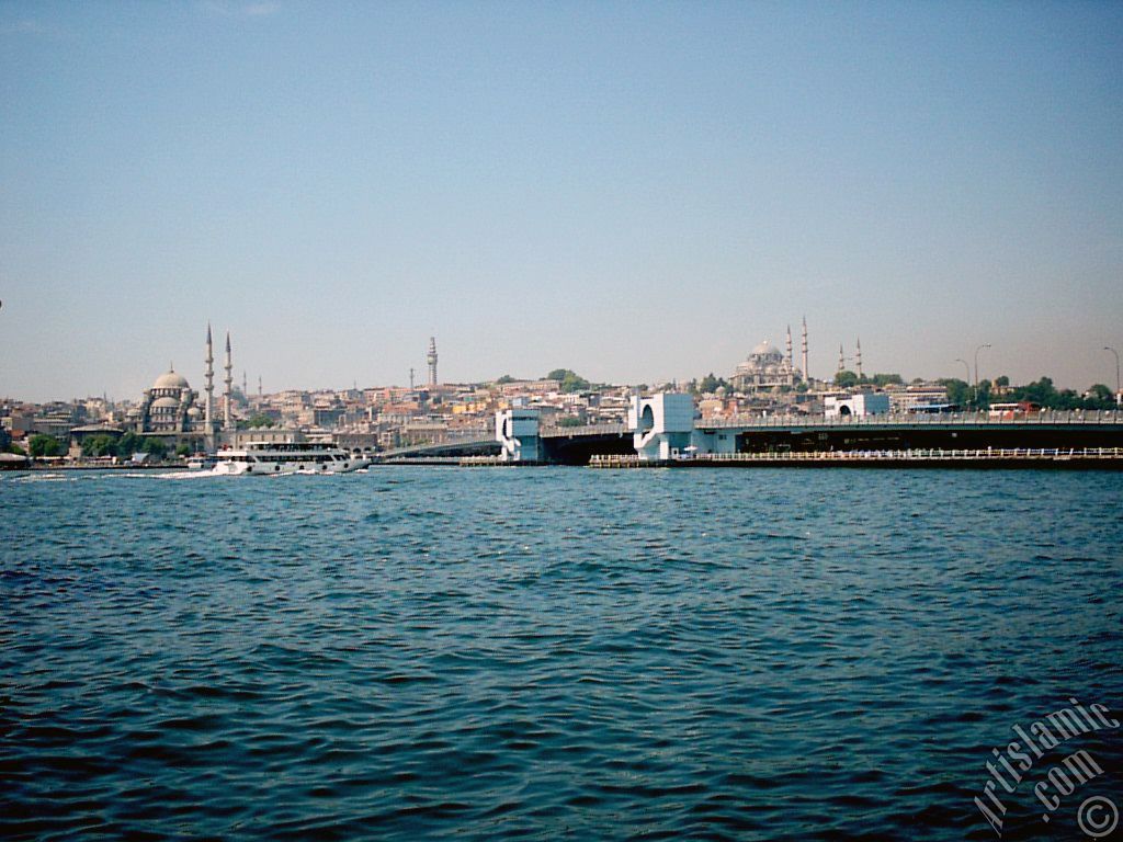 View of (from left) Yeni Cami (Mosque), (at far behind) Beyazit Mosque, Beyazit Tower, Galata Brigde and Suleymaniye Mosque from the shore of Karakoy in Istanbul city of Turkey.
