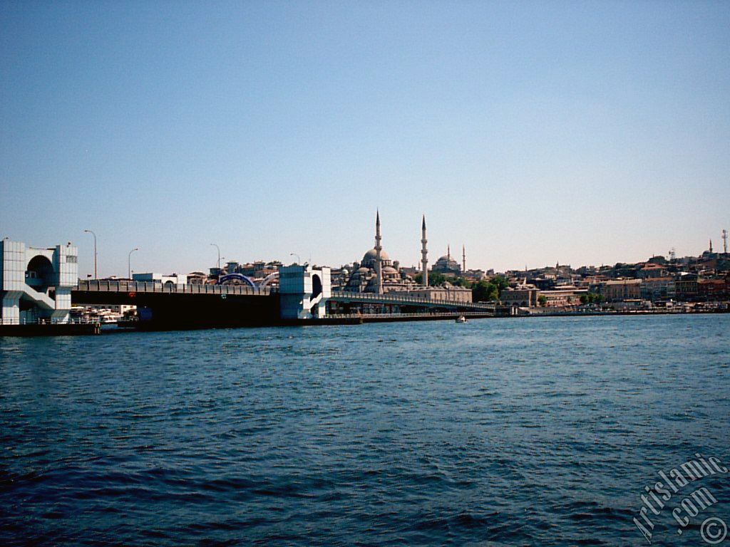 View of Eminonu coast, (from left) Galata Bridge, Yeni Cami (Mosque), Sultan Ahmet Mosque (Blue Mosque) and (below) Egyptian Bazaar (Spice Market) from the shore of Karakoy-Persembe Pazari in Istanbul city of Turkey.
