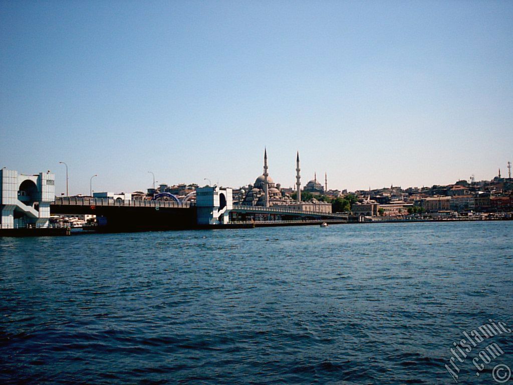 View of Eminonu coast, (from left) Galata Bridge, Yeni Cami (Mosque), Sultan Ahmet Mosque (Blue Mosque) and (below) Egyptian Bazaar (Spice Market) from the shore of Karakoy-Persembe Pazari in Istanbul city of Turkey.
