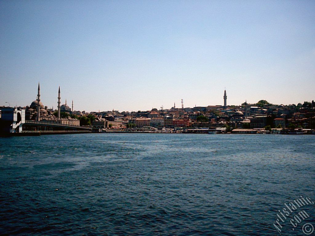 View of Eminonu coast, (from left) Galata Bridge, Yeni Cami (Mosque), Sultan Ahmet Mosque (Blue Mosque), (below) Egyptian Bazaar (Spice Market) and Beyazit Tower from the shore of Karakoy-Persembe Pazari in Istanbul city of Turkey.
