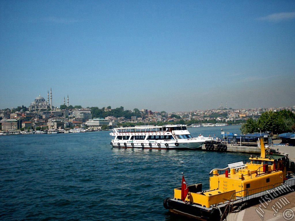 View of Eminonu coast, Suleymaniye Mosque (on the left) and (on the horizon) Fatih Mosque from the shore of Karakoy-Persembe Pazari in Istanbul city of Turkey.
