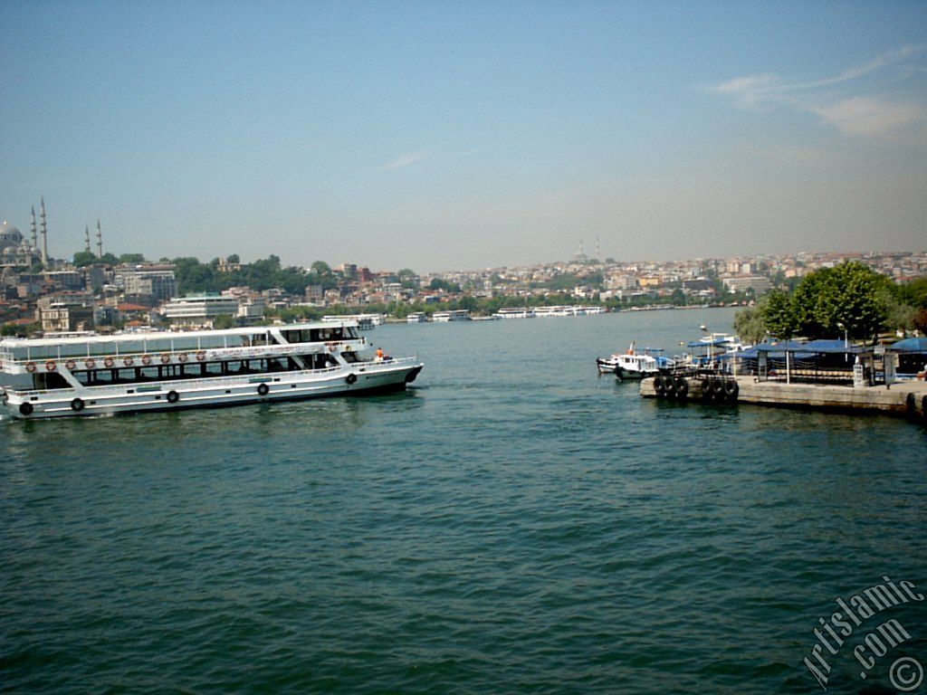 View of Karakoy-Persembe Pazari coast, Suleymaniye Mosque and on the horizon Fatih Mosque from Galata Bridge located in Istanbul city of Turkey.
