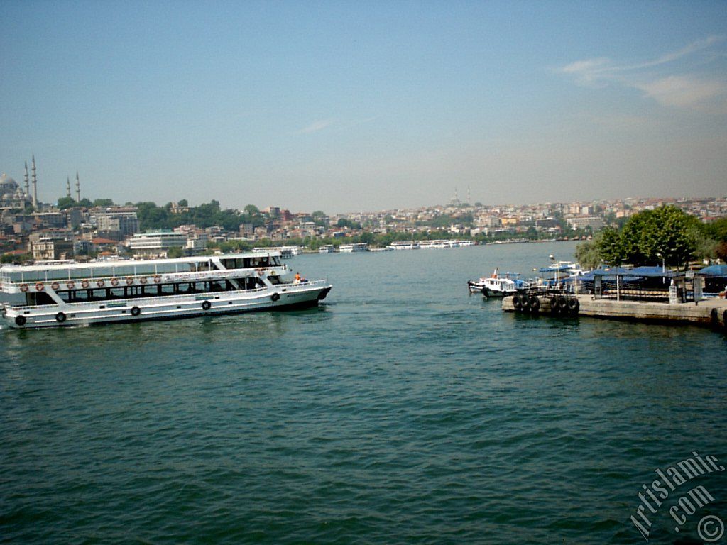 View of Karakoy-Persembe Pazari coast, Suleymaniye Mosque and on the horizon Fatih Mosque from Galata Bridge located in Istanbul city of Turkey.
