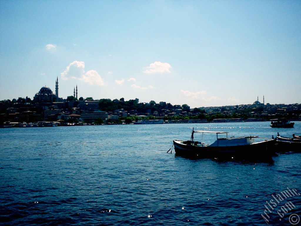 View of Eminonu coast, Suleymaniye Mosque (on the left) and (on the horizon) Fatih Mosque from the shore of Karakoy-Persembe Pazari in Istanbul city of Turkey.
