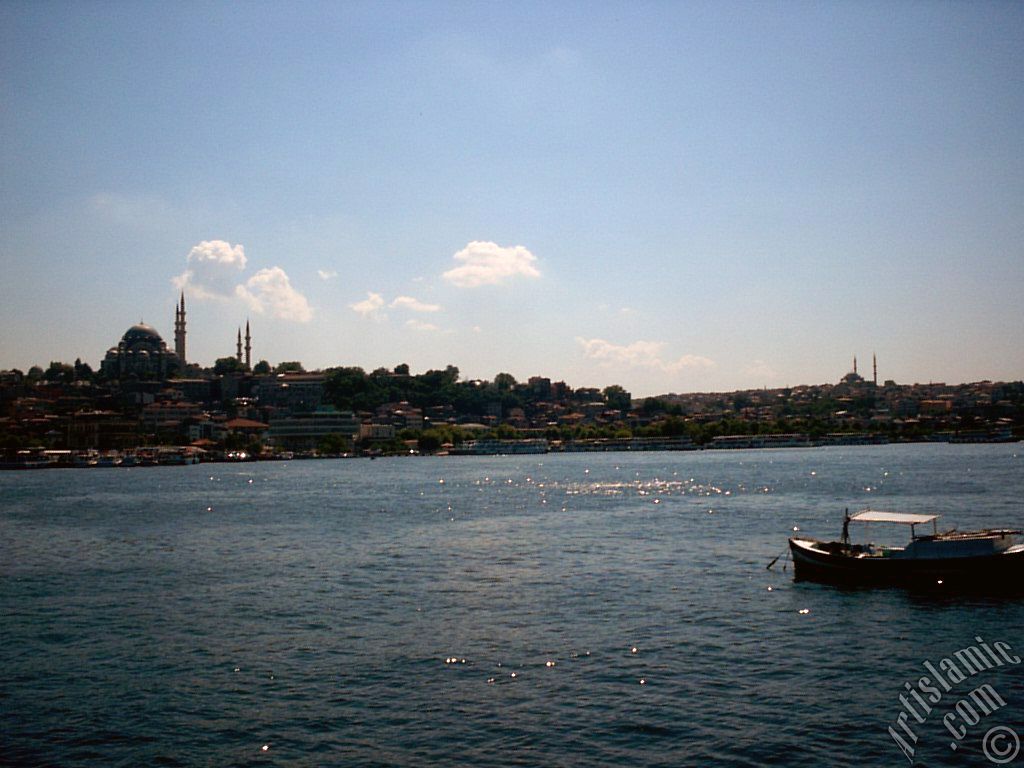 View of Eminonu coast, Suleymaniye Mosque (on the left) and (on the horizon) Fatih Mosque from the shore of Karakoy-Persembe Pazari in Istanbul city of Turkey.
