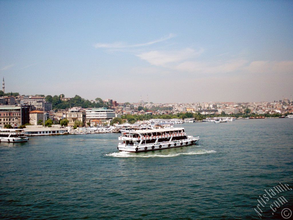 View of Eminonu-Sarachane coast, on the horizon in the middle Fatih Mosque and on the right Yavuz Sultan Selim Mosque from Galata Bridge located in Istanbul city of Turkey.
