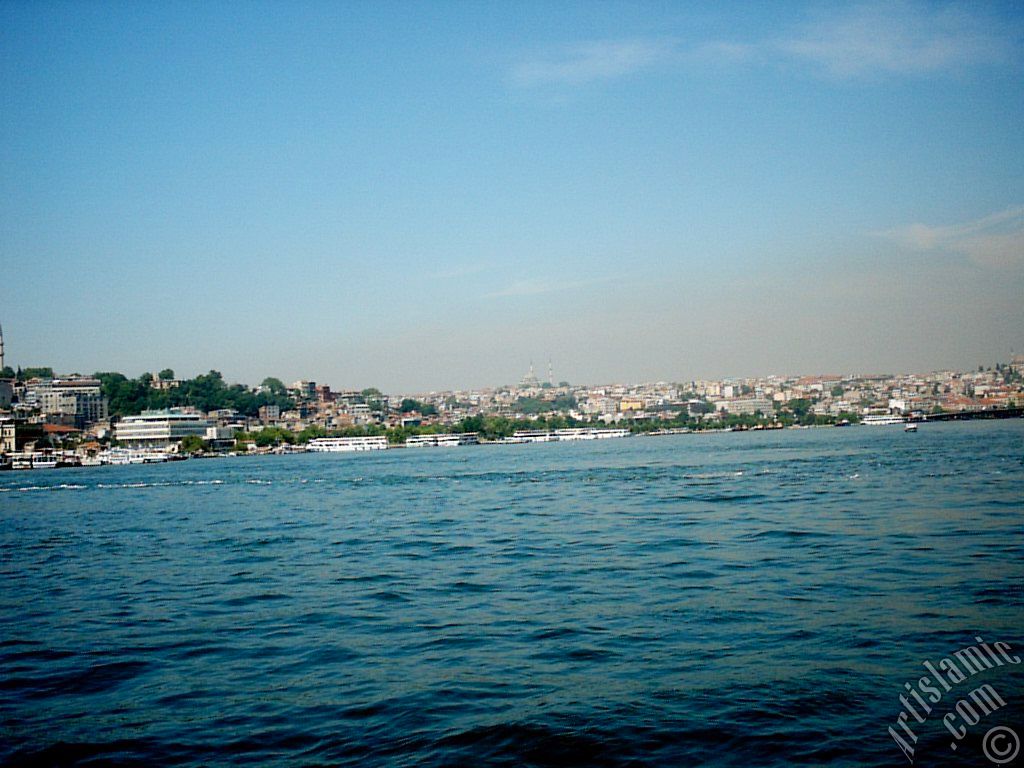 View of Eminonu-Sarachane coast, on the horizon in the middle Fatih Mosque and on the right Yavuz Sultan Selim Mosque from Galata Bridge located in Istanbul city of Turkey.
