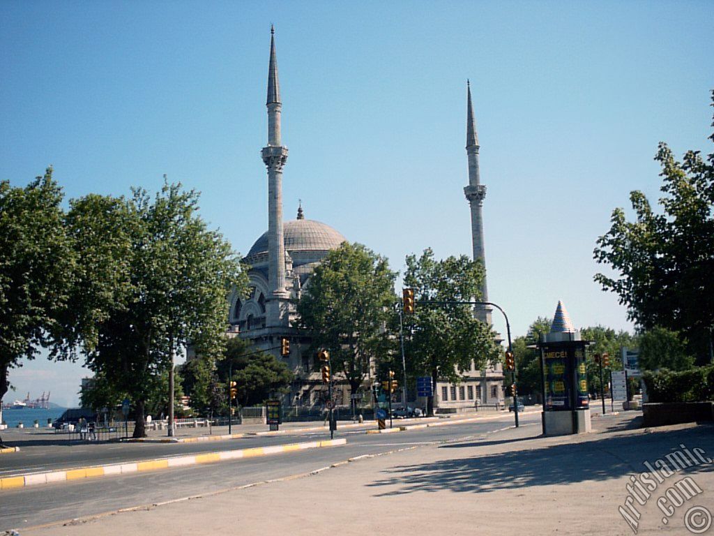 View of Dolmabahce coast and Valide Sultan Mosque in Dolmabahce district in Istanbul city of Turkey.
