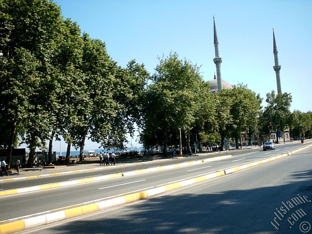 View of Dolmabahce coast and Valide Sultan Mosque in Dolmabahce district in Istanbul city of Turkey.
