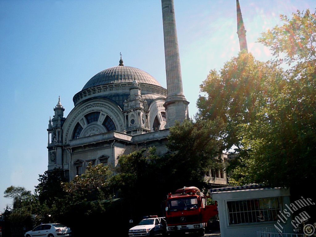 View of Valide Sultan Mosque from the entrance of the Dolmabahce Palace in Dolmabahce district in Istanbul city of Turkey.
