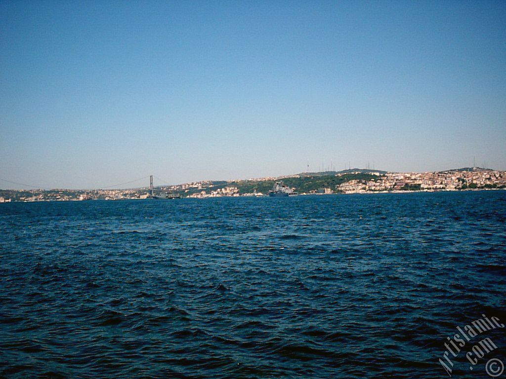 View towards Bosphorus Bridge and Uskudar coast from a park at Kabatas shore in Istanbul city of Turkey.
