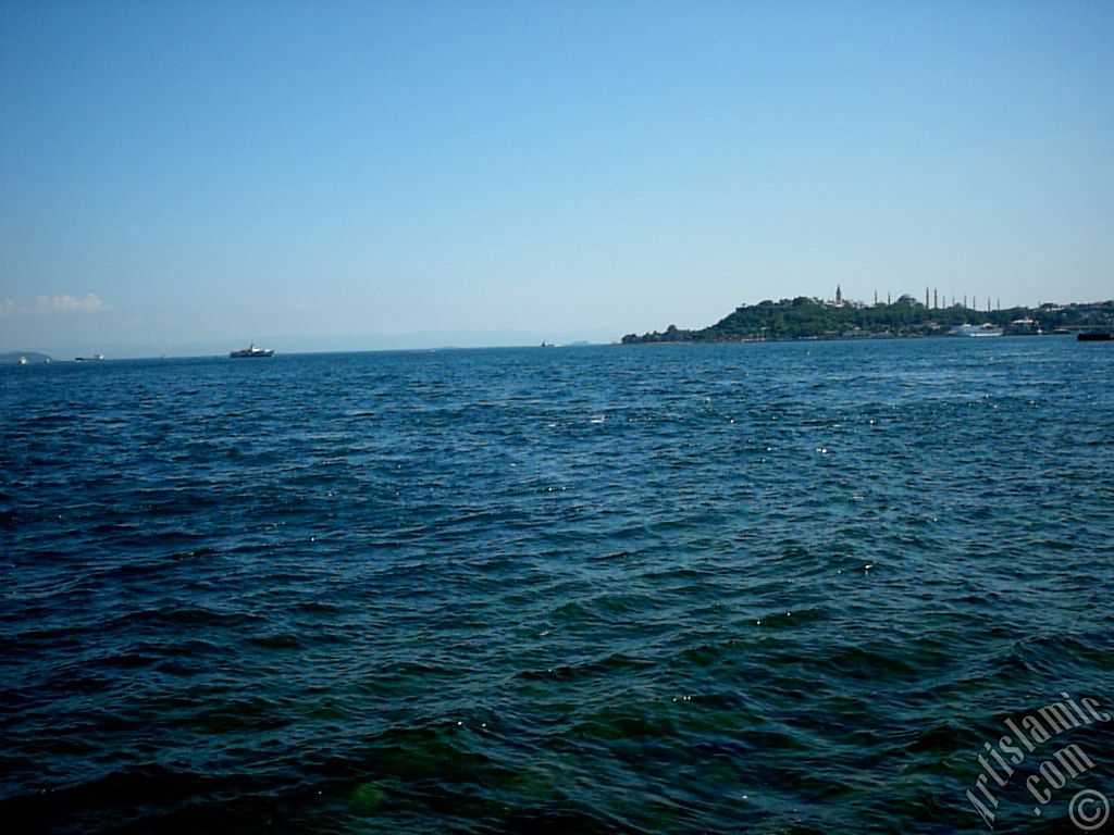 View towards Sarayburnu coast, Topkapi Palace, Ayasofya Mosque (Hagia Sophia) and  Sultan Ahmet Mosque (Blue Mosque) from a park at Kabatas shore in Istanbul city of Turkey.
