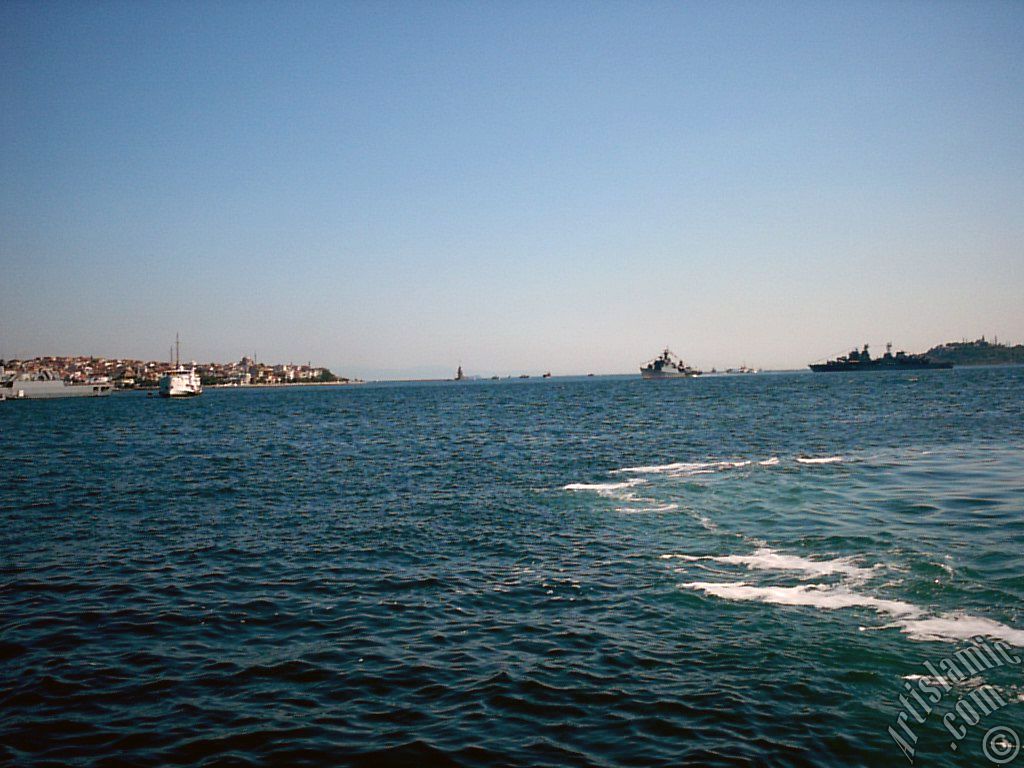 View of froth on the sea seen after a ship landed, on the horizon Kiz Kulesi (Maiden`s Tower), Uskudar coast on the left and Sarayburnu coast on the rigth from the shore of Besiktas in Istanbul city of Turkey.
