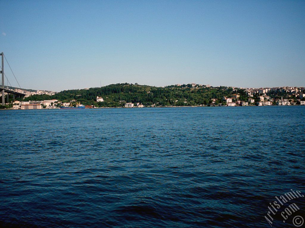 View of Bosphorus Bridge and Beylerbeyi coast from a park at Ortakoy shore in Istanbul city of Turkey.
